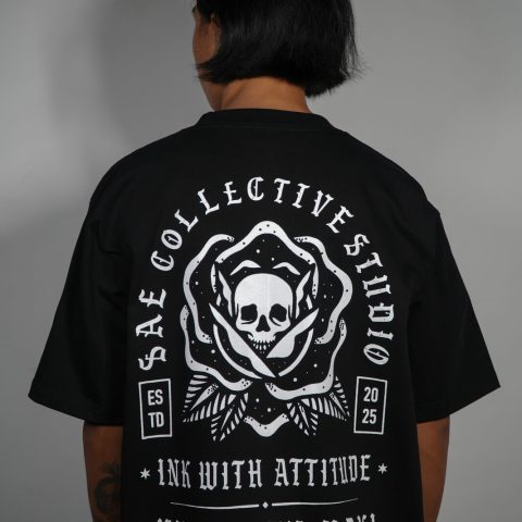 Sae Collective Studio t-shirt with a skull and rose crest reading Ink With Attitude
